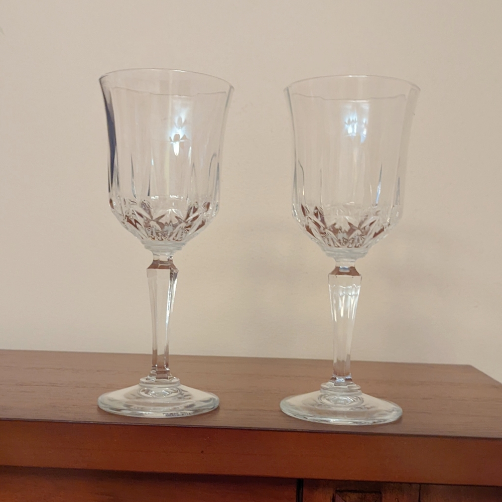 Vintage set of two etched crystal wine glasses.